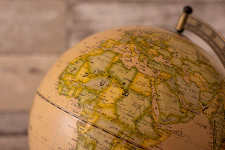 Old globe on a wooden background - North Africa, Europe, Midle eastの写真素材