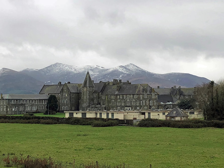 Snow capped mountains in the background of historical buildingsのeditorial素材