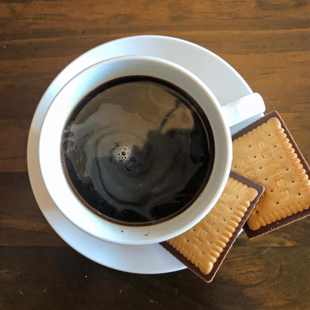 Cup of coffee with biscuits