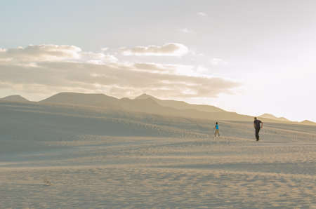 Exploring the dunes of Corralejo, in Fuerteventura (Canary islands)の写真素材
