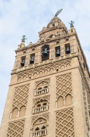 La Giralda is a bell tower of the Seville Cathedral in Seville, Spainの写真素材