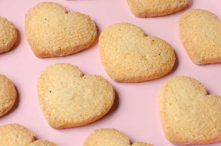 Pink tray with butter and sugar cookies (heart shaped).