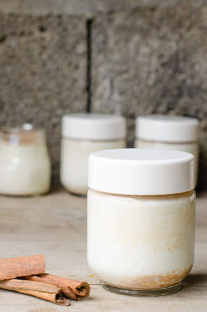 Homemade cinnamon yogurt, rustic background.の写真素材