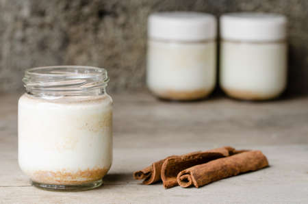 Homemade cinnamon yogurt, rustic background.の写真素材