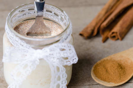 Homemade cinnamon yogurt, rustic background.の写真素材