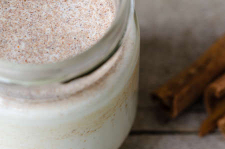 Homemade cinnamon yogurt, rustic background, closeup view.の写真素材