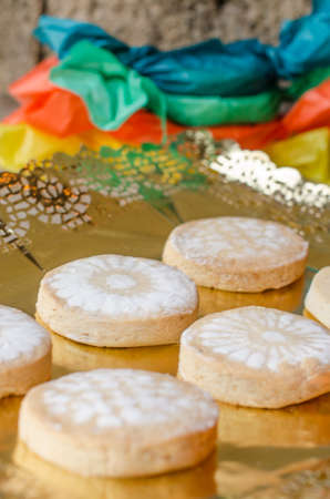 Mantecados and Polvorones,  wrapped with colored paper, on rustic background, typical Spanish Christmas sweets.の写真素材