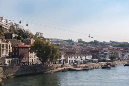View on Vila Nova de Gaia on Douro river in Porto, Portugal. Popular touristic attraction and...