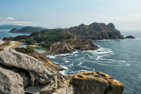 Stone cliffs, paradise beach and emerald lake, beautiful views from the viewpoint of Alto del Principe, Cies Islands, Galicia, Spainの写真素材
