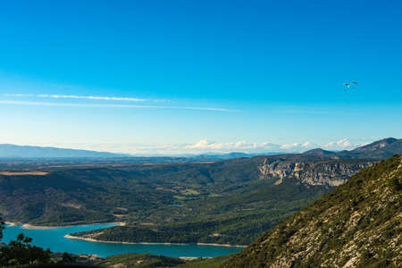 Two paratroopers flying over the  blue Lac de Sainte-Croix lake near Verdon gorges in Provence, Franceの写真素材