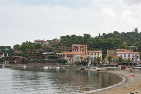 Old town of Collioure, France, a popular resort town on Mediterranean sea, view from the beach.