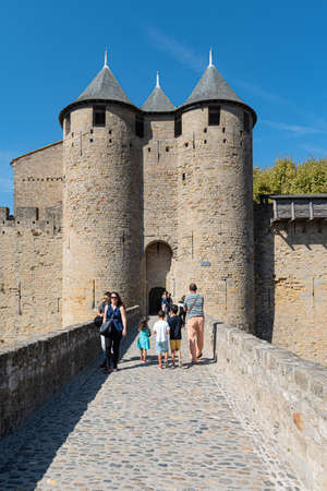 Comtal Castle entrance. Carcassonne, Aude, Occitanie, France, Europe. Tourists wlaking inside the castle. Medieval city UNESCO world heritage siteのeditorial素材