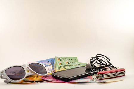 Holidays object:ap, money, smartphone and sunglassesの写真素材