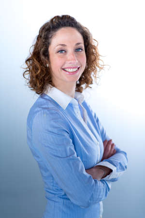 portrait of a beautiful and sexy young woman on light backgroungの写真素材