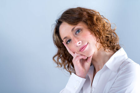 portrait of a beautiful and sexy young woman on light backgroungの写真素材