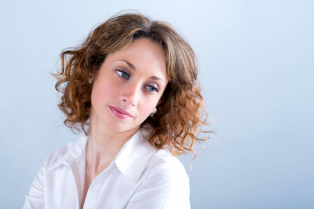 portrait of a beautiful and sexy young woman on light backgroungの写真素材