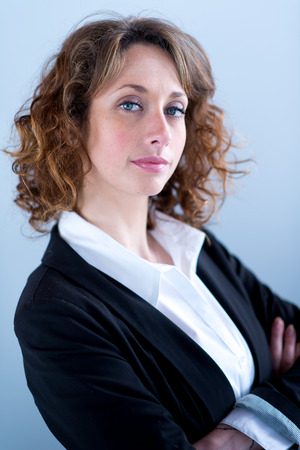 isolated portrait of a beautiful young executive womanの写真素材