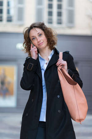 beautiful young woman walking and shoping downtownの写真素材