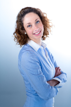 portrait of a beautiful and sexy young woman on light backgroungの写真素材