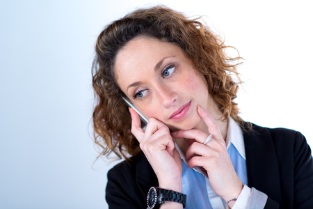 isolated portrait of a beautiful young executive womanの写真素材