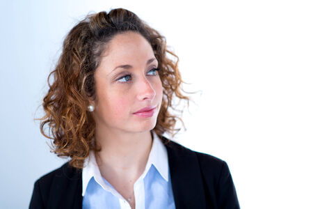 isolated portrait of a beautiful young executive womanの写真素材