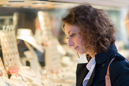 beautiful young woman walking and shoping downtownの写真素材