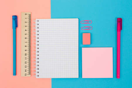 Top above overhead view photo of pink and blue colorful note pad pensの写真素材