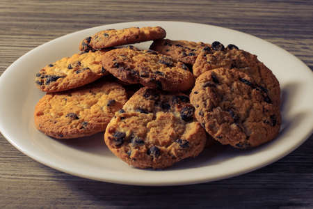 Candy cookies baked bakery homemade holiday fresh healthy eating diet weight loss unhealthy concept. Side profile close up view photo of tasty crispy cookies isolaed on grayの写真素材