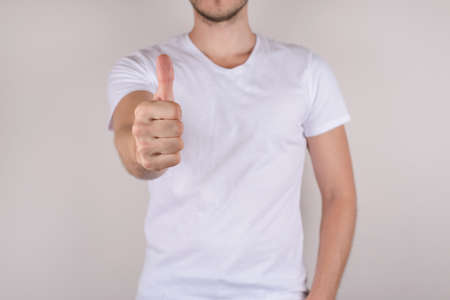 Impress success influence win follow offer concept. Cropped close up photo portrait of handsome confident candid content guy demonstrating finger up isolated on gray background copy spaceの写真素材