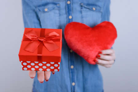 Trend paper sorry forgive date anniversary new year christmas xmas father send receive people person concept. Cropped close up photo of cute lovely lady with gift in hands isolated on gray backgroundの写真素材