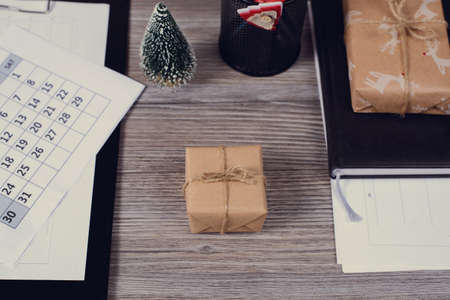 Wait for holiday concept. Above high angle overhead close up view photo of beautiful cute dreamy paper postal box on grey wooden table near date on calendar diaryの写真素材