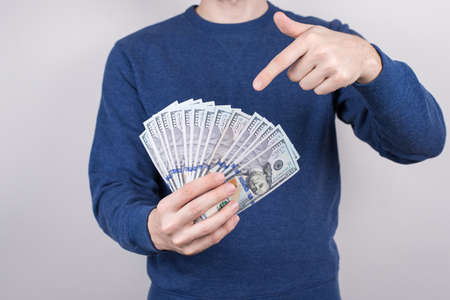 Cropped close-up studio photo of confident luck lucky student demonstrating lot of money getting...
