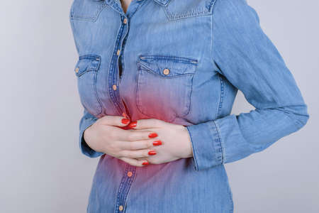 Digestion indigestion people person concept. Cropped close up photo of sad unhappy stressed...