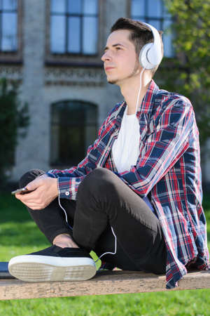 Side profile photo of confident dream dreamy concentrated guy listening to musicの写真素材