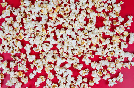 Top above high angle overhead closeup view photo of tasty popcorn isolated over vivid color backgroundの写真素材