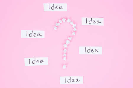 What idea will be good concept. Closeup high angle view flat lay studio photo of question mark made...