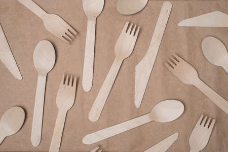 Top above overhead view photo of wooden cutlery isolated on craft paper background tableの写真素材