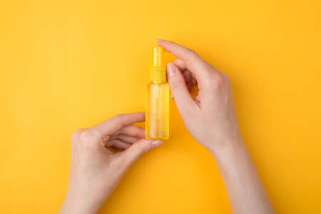 Keeping germs away from hands concept. Top above overhead close-up view photo of woman holding a...