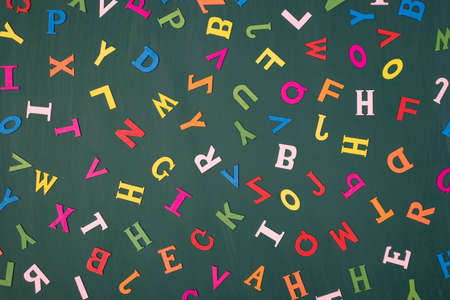 Letters background studying englidh language concept. Top above overhead view photo of colorful letters isolated on greenboardの写真素材