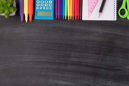 Top above overhead view photo of colorful stationery and succulent placed from above isolated on blackboard with copyspaceの写真素材