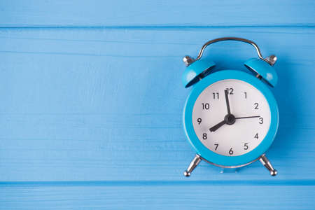 Deadline concept. Top above overhead view close-up photo of blue clock isolated on blue wooden...
