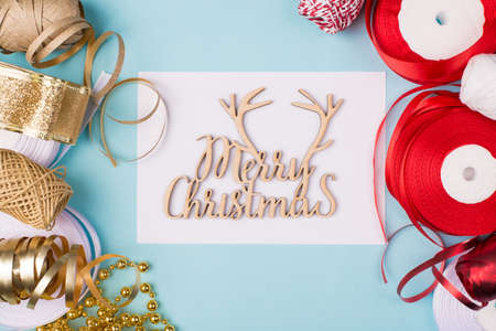 Merry Christmas concept. Top above overhead close up view photo of ribbon rope for packing giftboxes on blue backgroundの写真素材