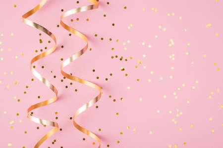 Partying concept. Top above overhead view close up photo of confetti isolated on patel pink backgroundの写真素材