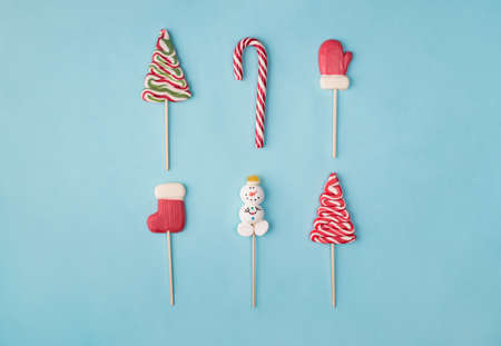 Top above overhead close up view photo of layout sweet traditional christmas candies isolated over...