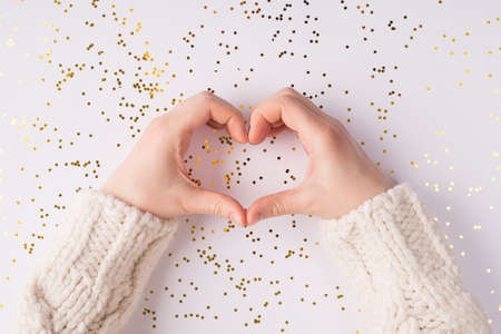 Happy St Valentine day concept. Top above overhead close up photo of girl making showing hear symbol...