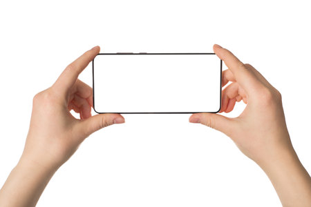 Traveling and making selfie concept. Pov cropped close up photo of female hands holding telephone taking picture isolated white backgroundの写真素材