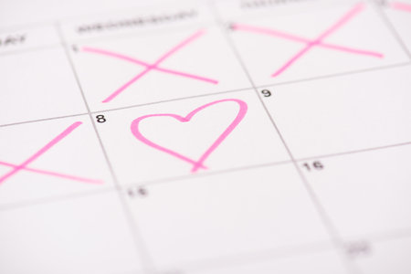 Happy women's day concept. Close up photo picture of calendar cell and and drawn pink heart on itの写真素材