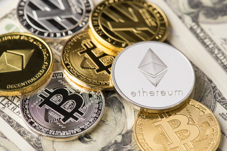 Top above close up view photo of many lot of different golden and silver crypto currency laying on pile stack of american dollarsの写真素材