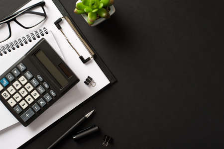 Bookkeepers work place concept. Top above overhead view photo of office accessories calculator pen...