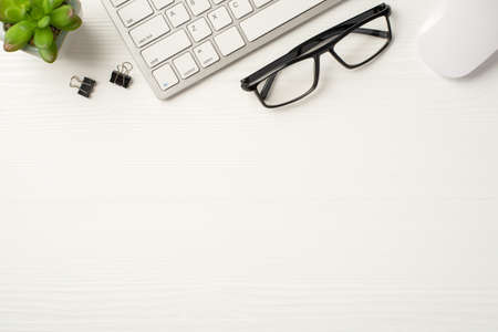 Workplace of it specialist concept. Flat lay above view photo of eyewear pc mouse and keyboard...